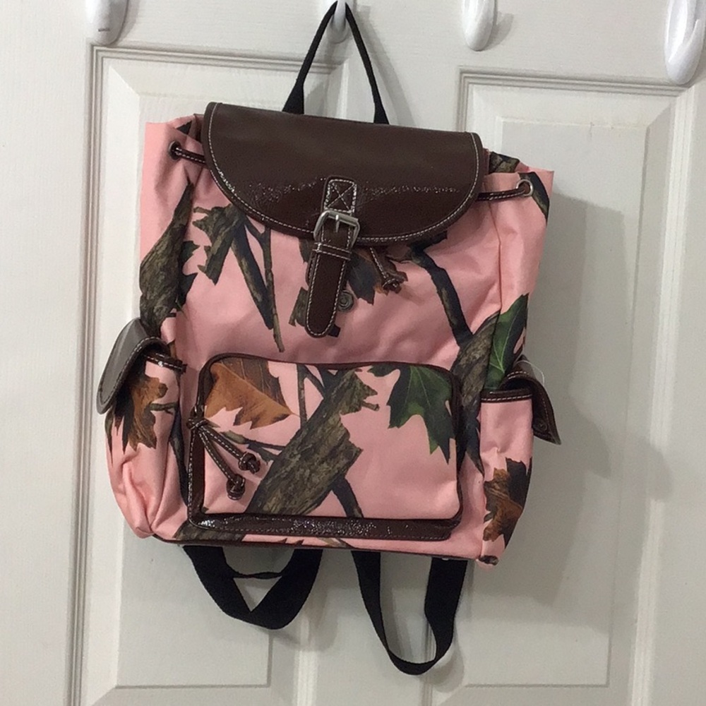 Large canvas Pink Forest brand backpack w/ a lot of room in main compartment.
